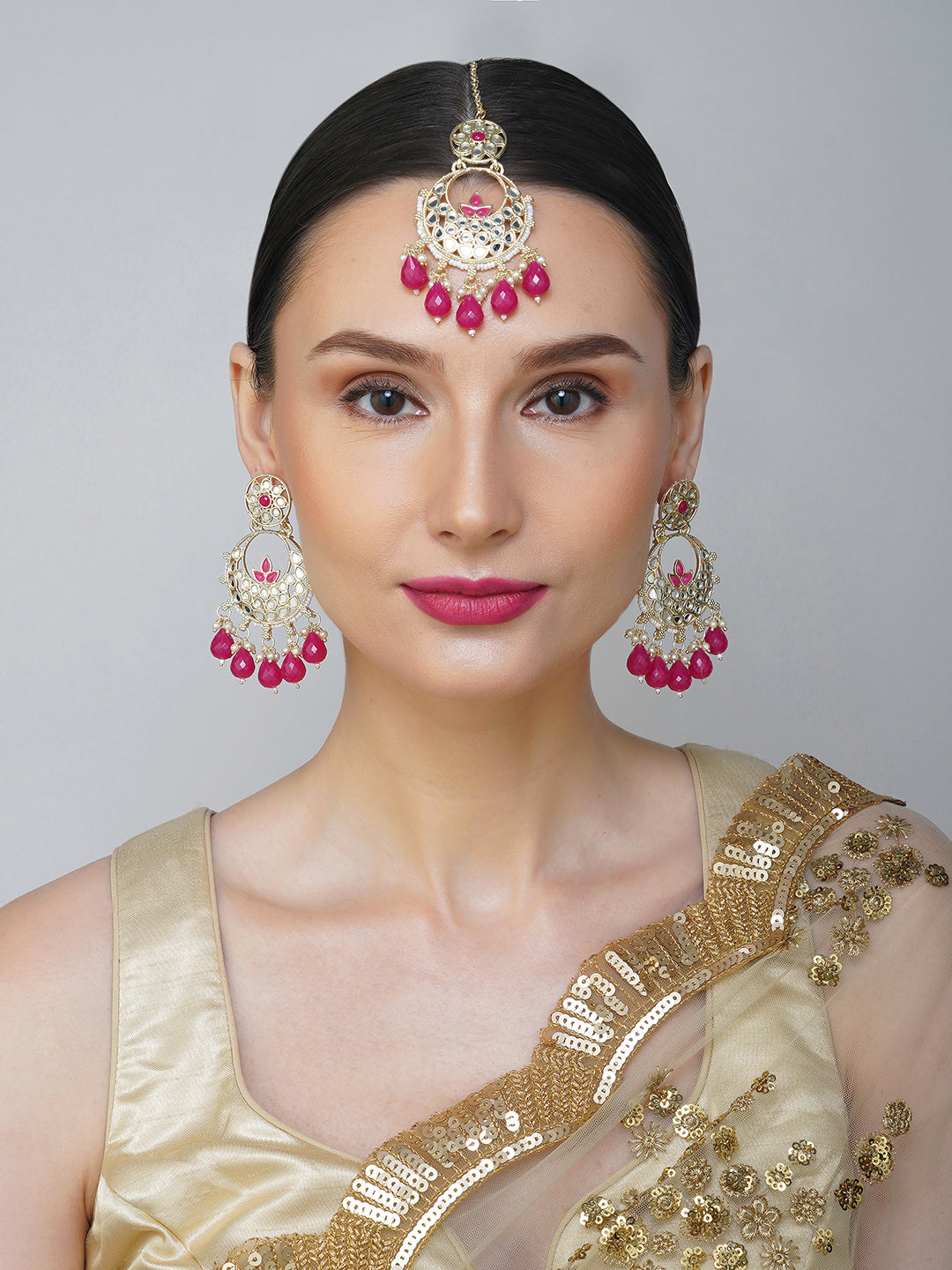 magenta earring and maang tikka model front view