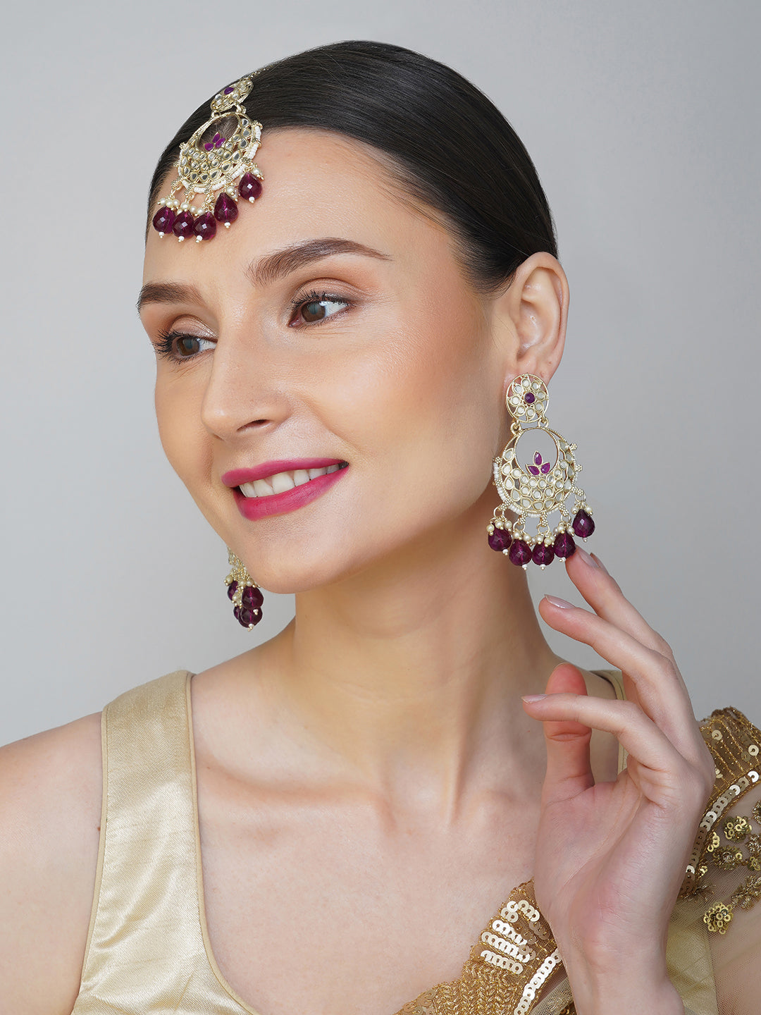 purple earring and maang tikka model side view