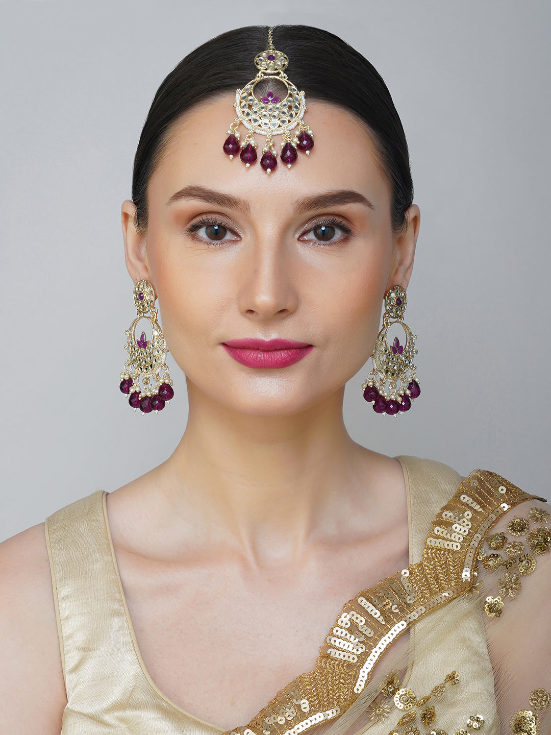 purple earring and maang tikka model front view