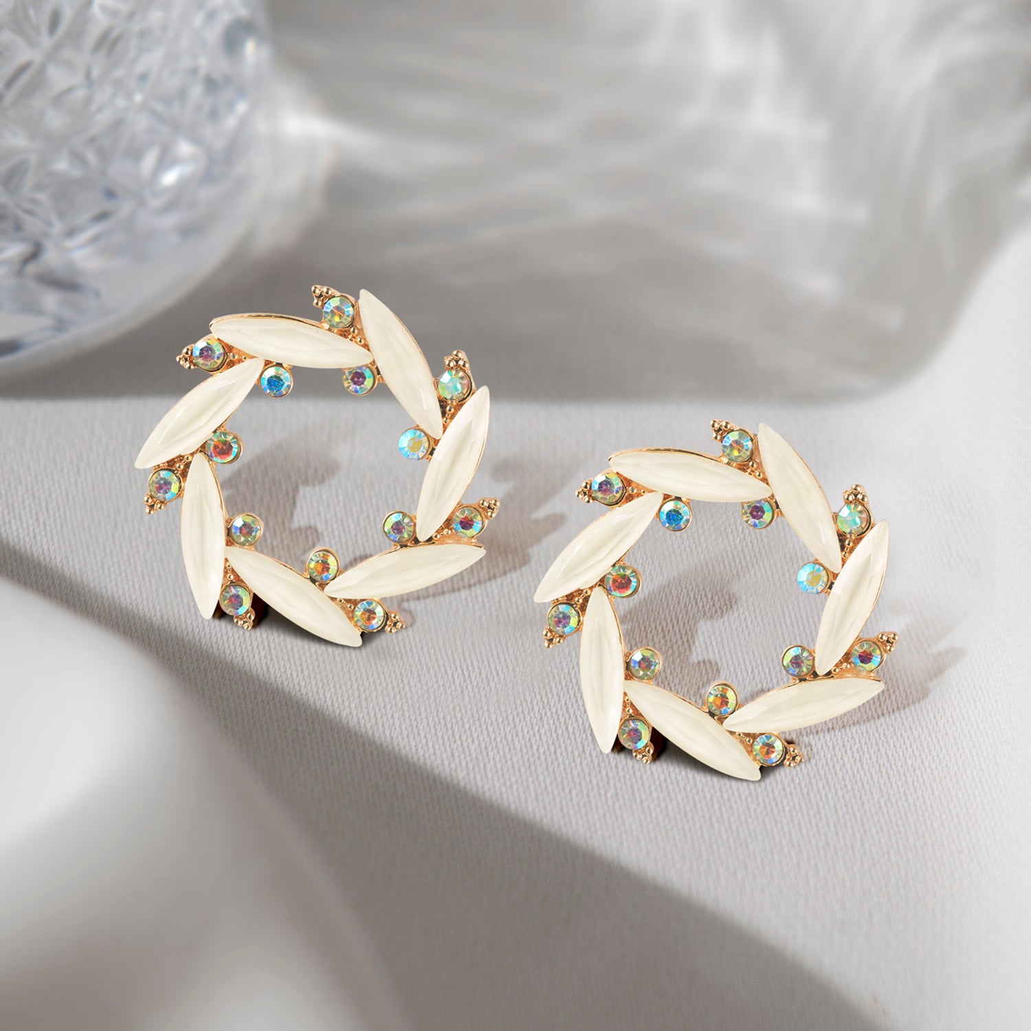 white crystal stud earring grey background