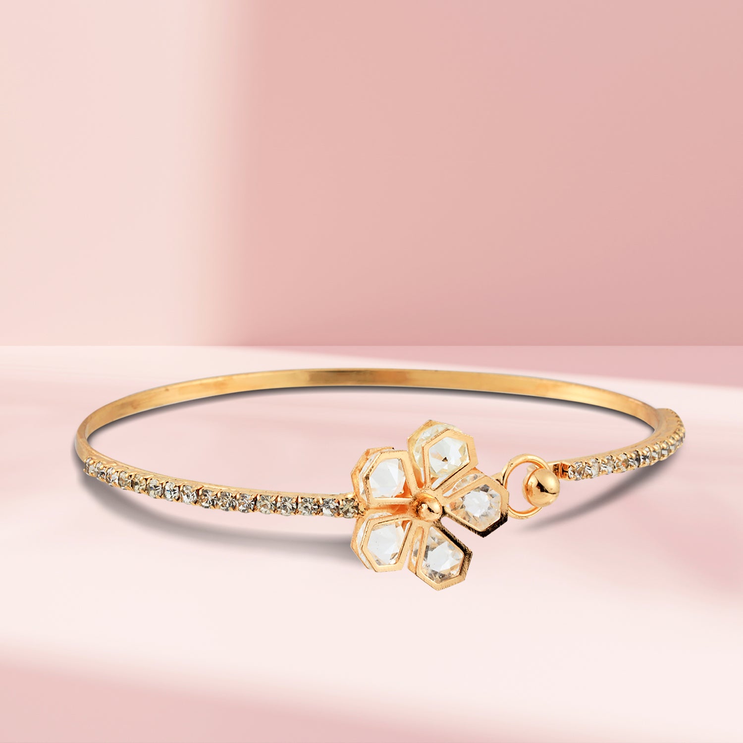 gold flower diamond bracelet light peach background
