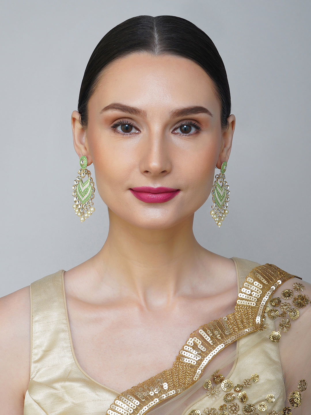 green kundan earrings model front view