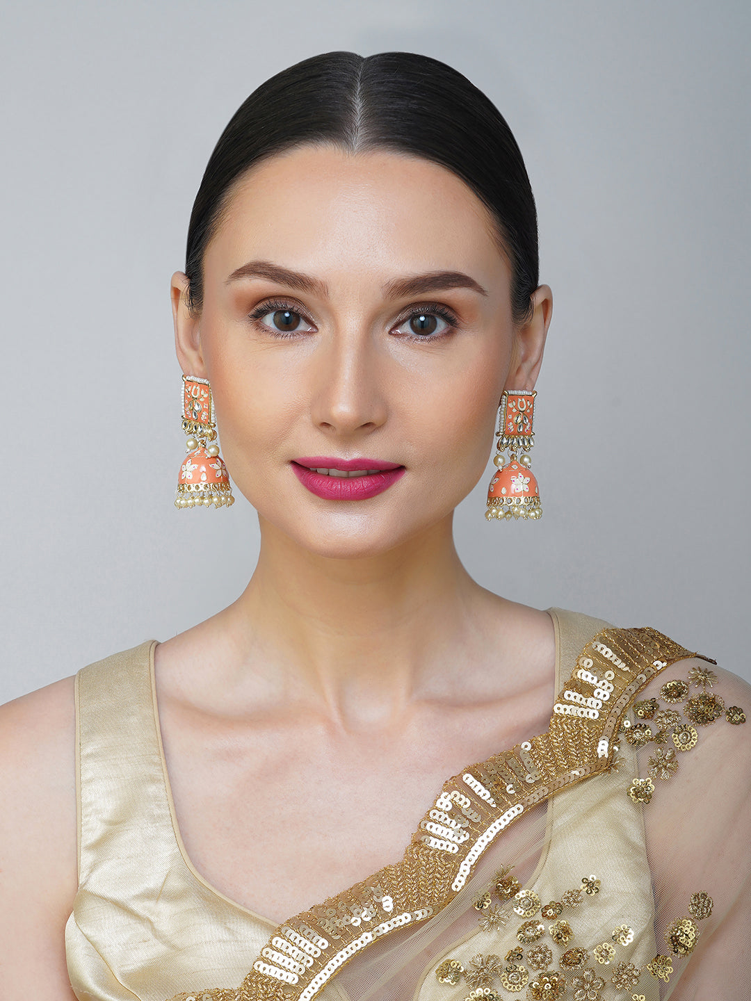 minakari peach jhumka earrings model front view