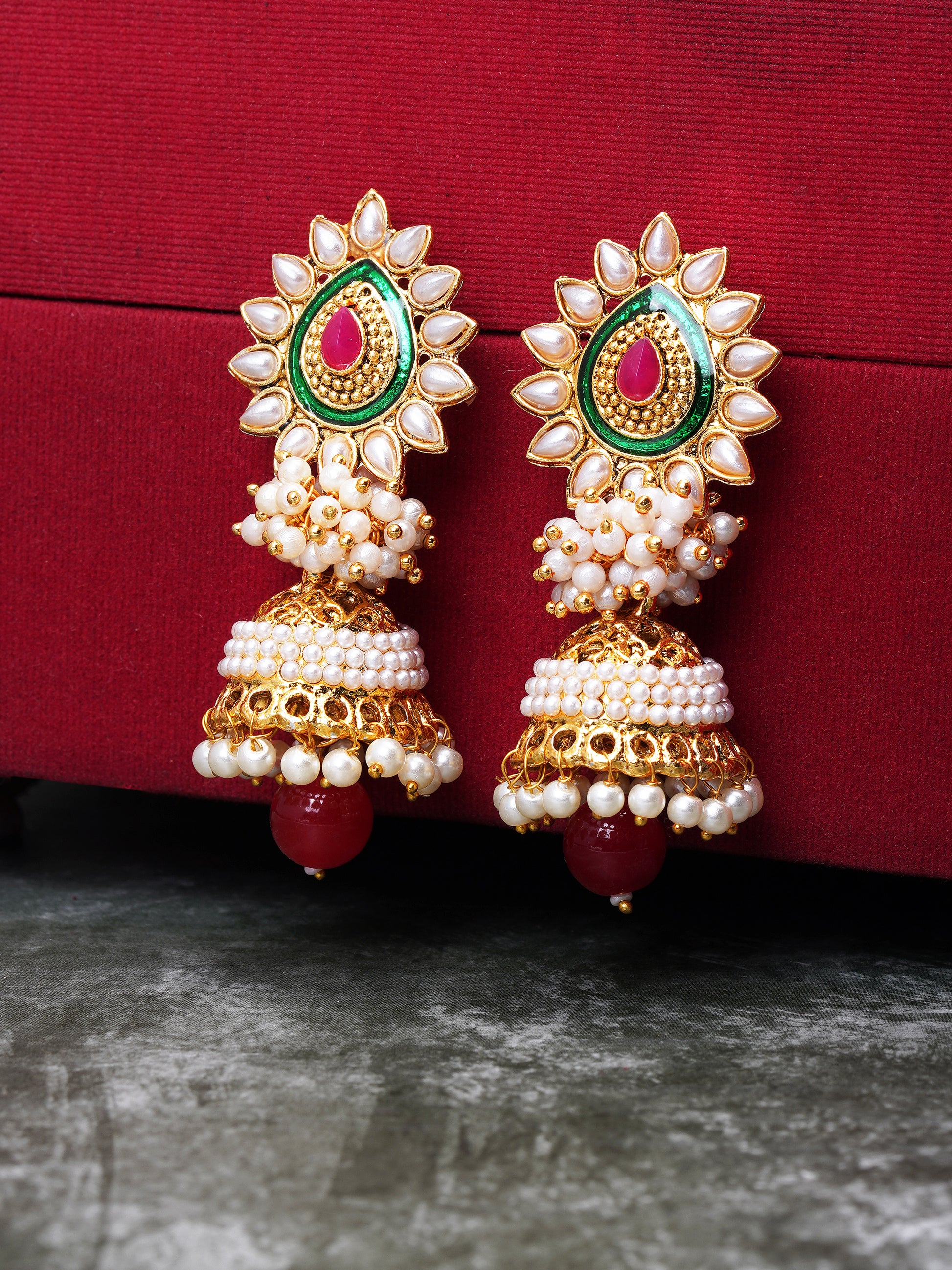 red and green pearl jhumka red backgrpund
