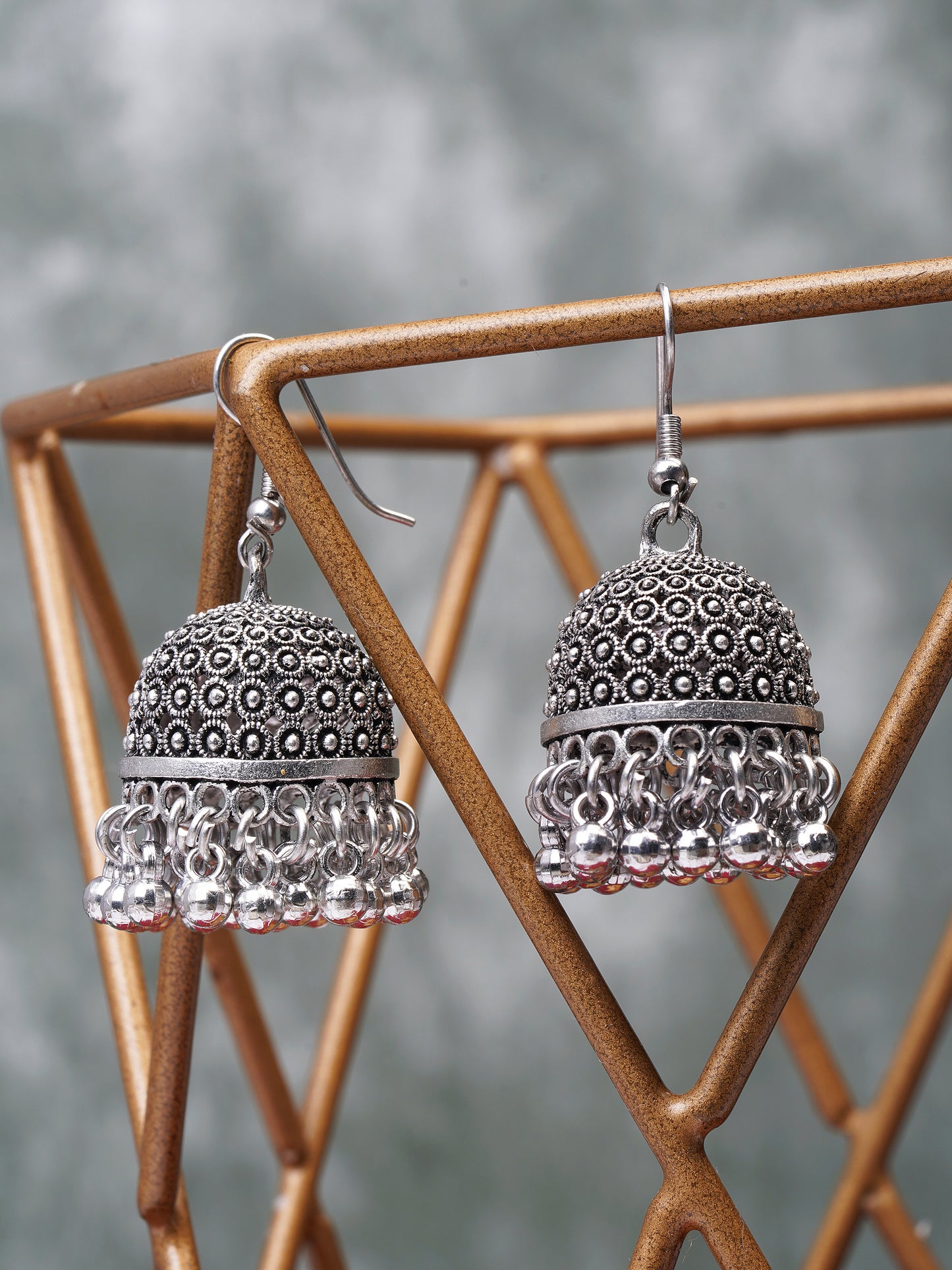 oxidised hook jhumka earring grey background