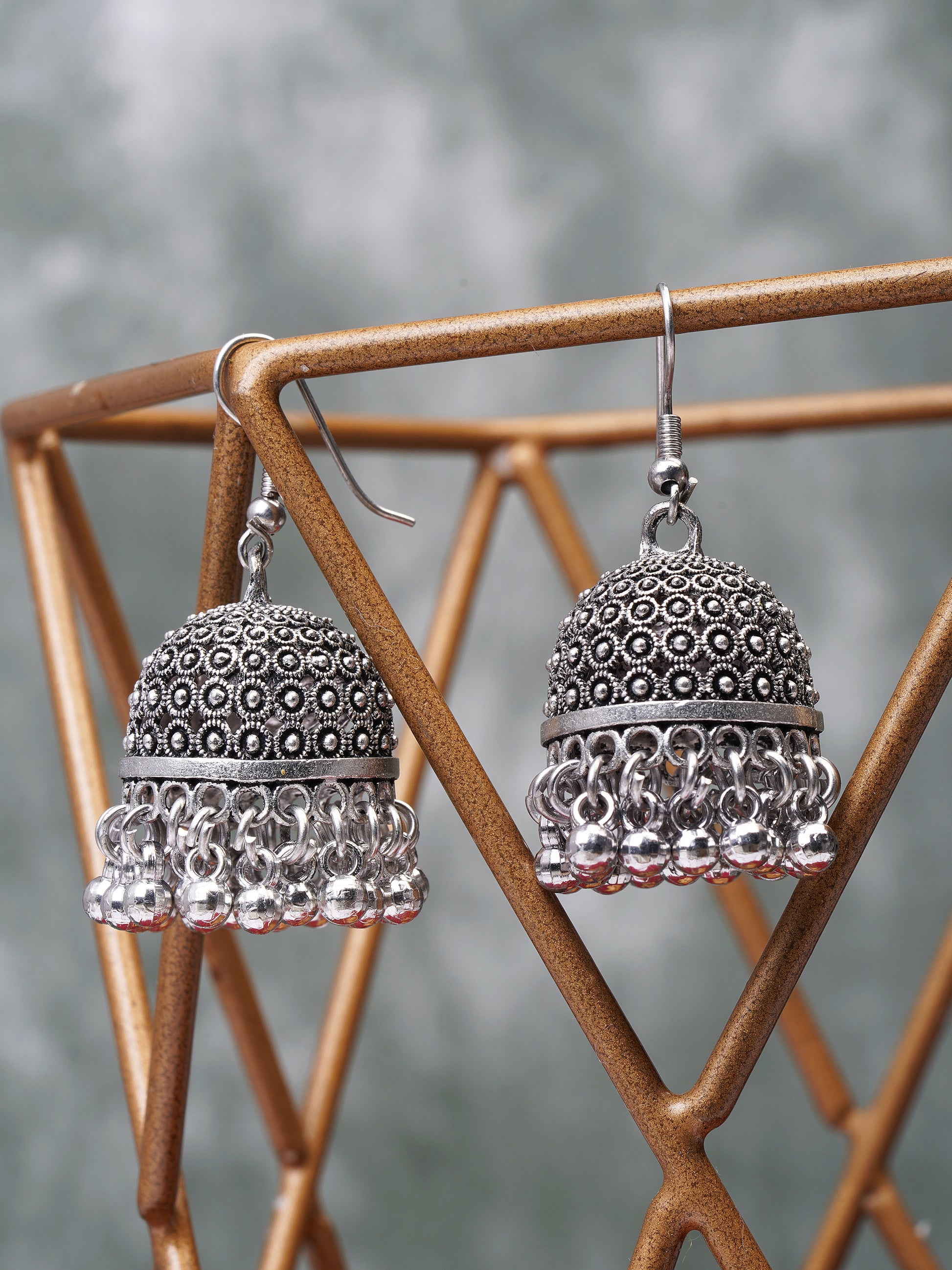 oxidised hook jhumka earring grey background