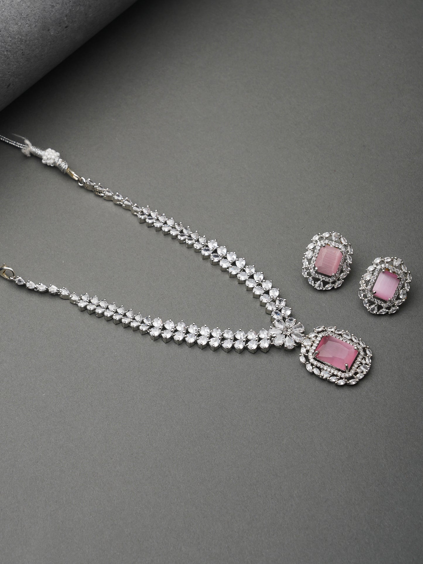 pink stone american diamond necklace set grey background