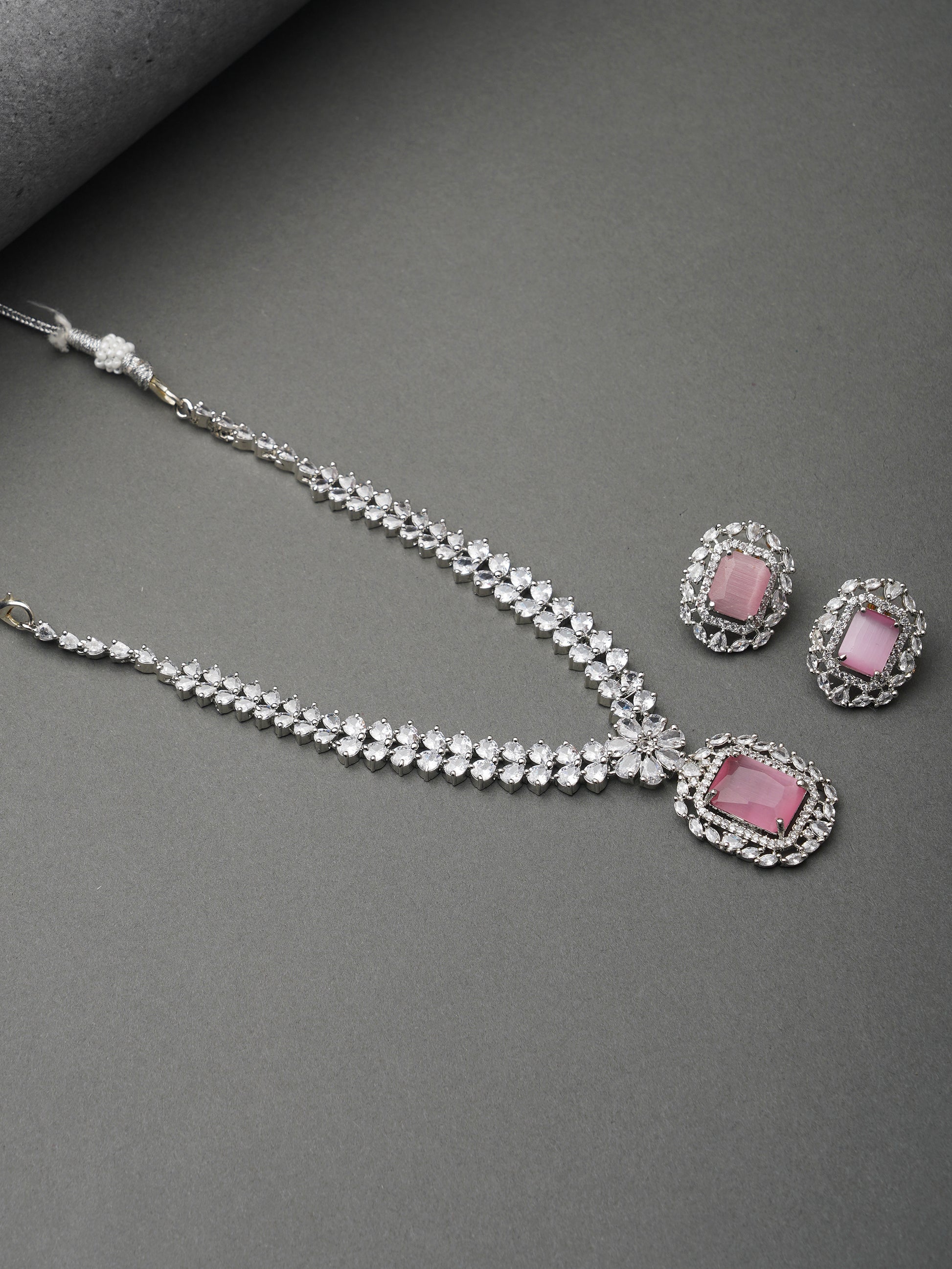pink stone american diamond necklace set grey background