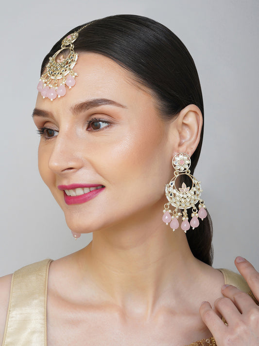 light pink earring and maang tikka  model side view