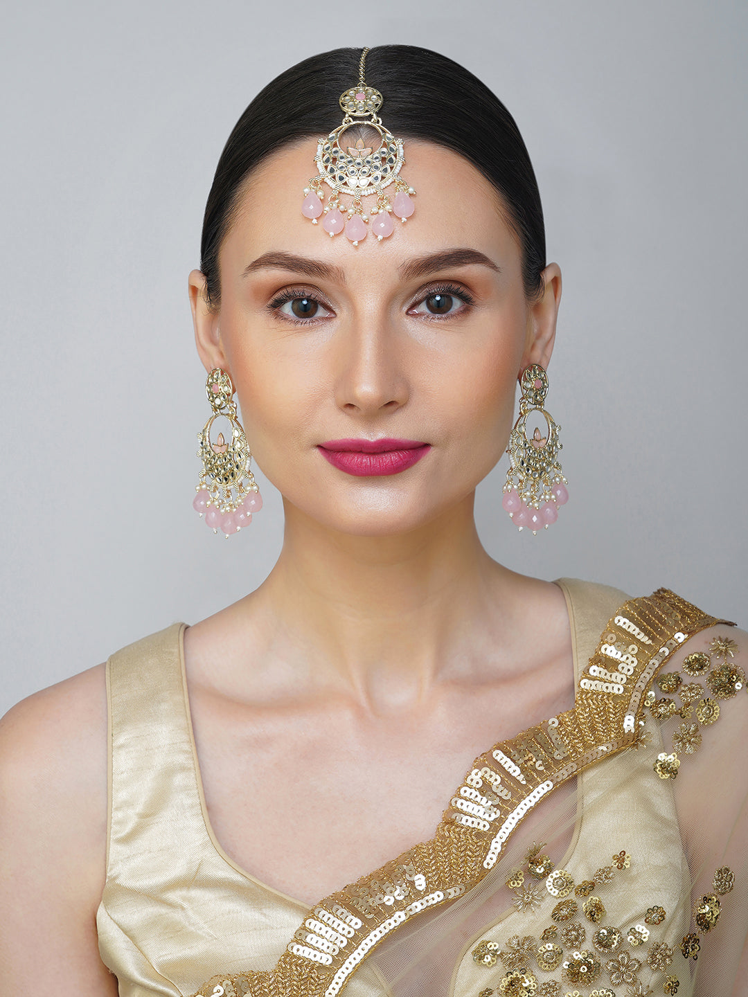 light pink earring and maang tikka  model front view