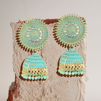 aqua green jhumka earrings stone background