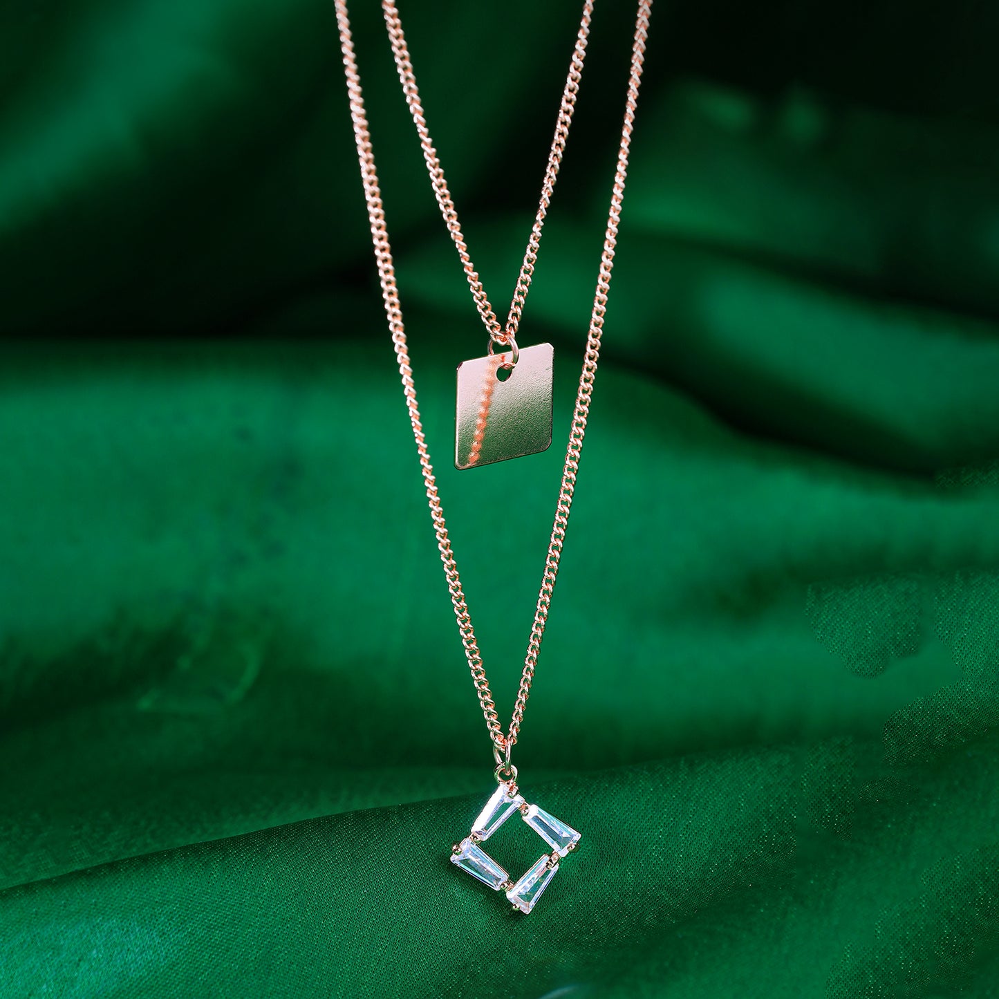 crystal rectangular pendant necklace green background