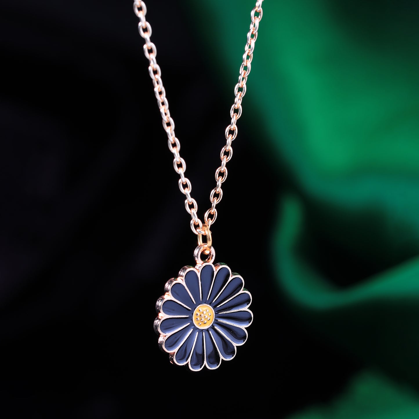 flower pendant chain necklace dark background