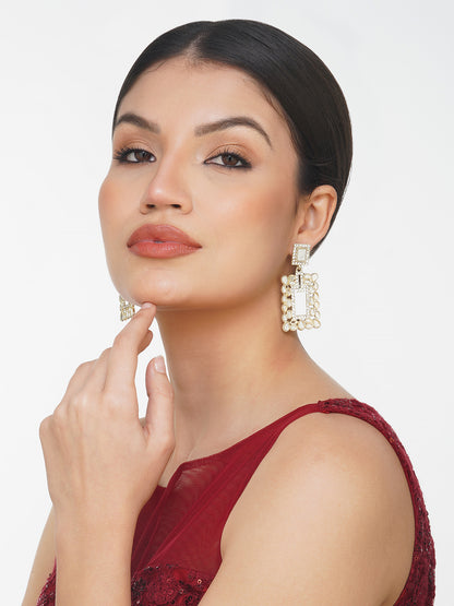 gold mirror drop earrings model side view