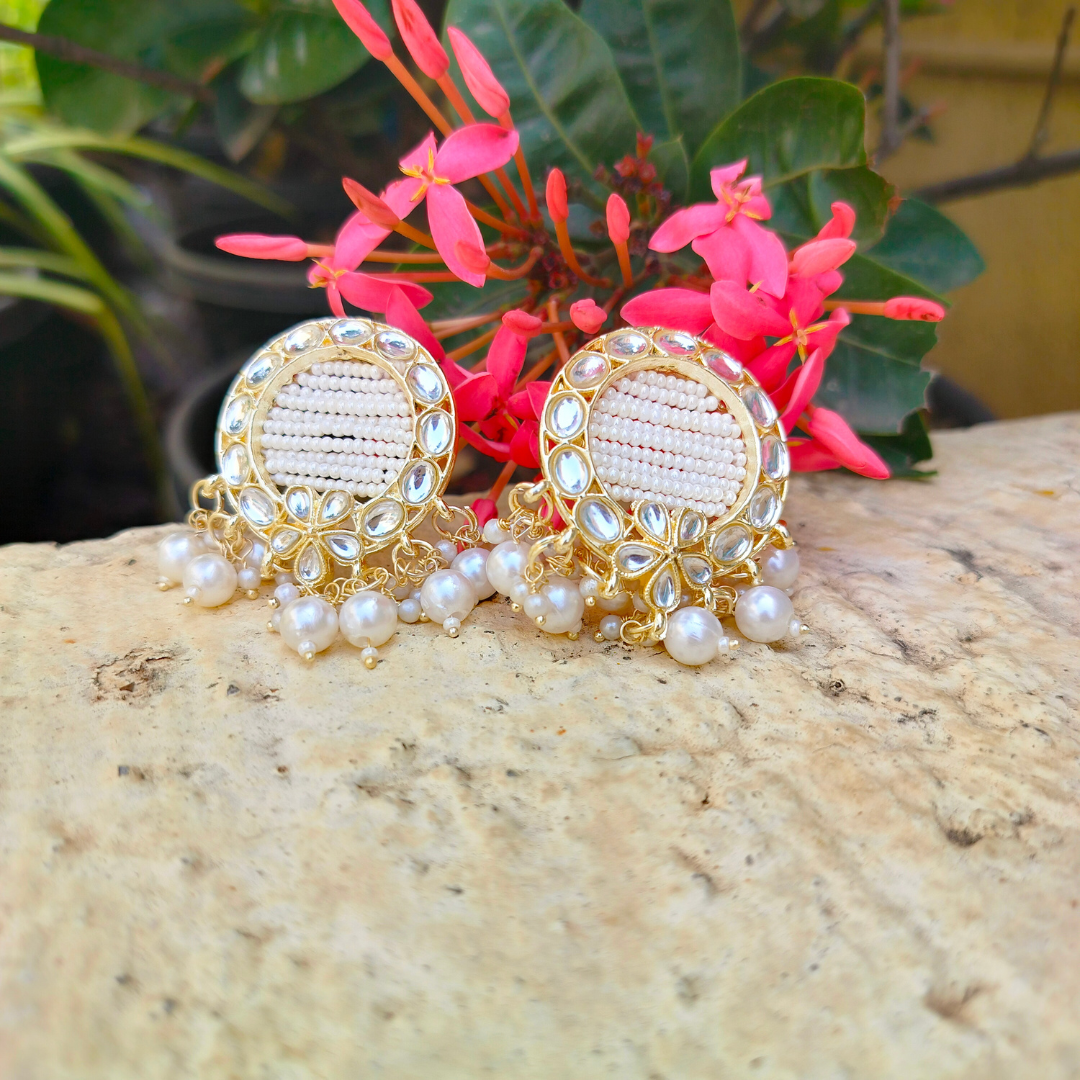 golden kundan pearl earrings flower background