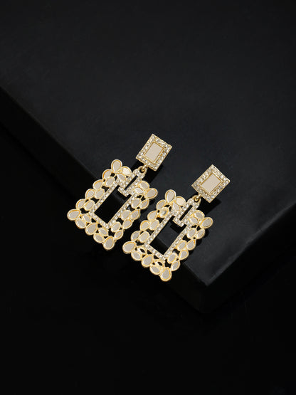 gold mirror drop earrings black background