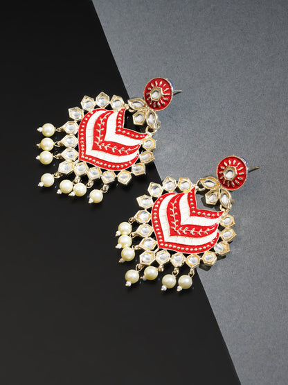 marron kundan earrings black background