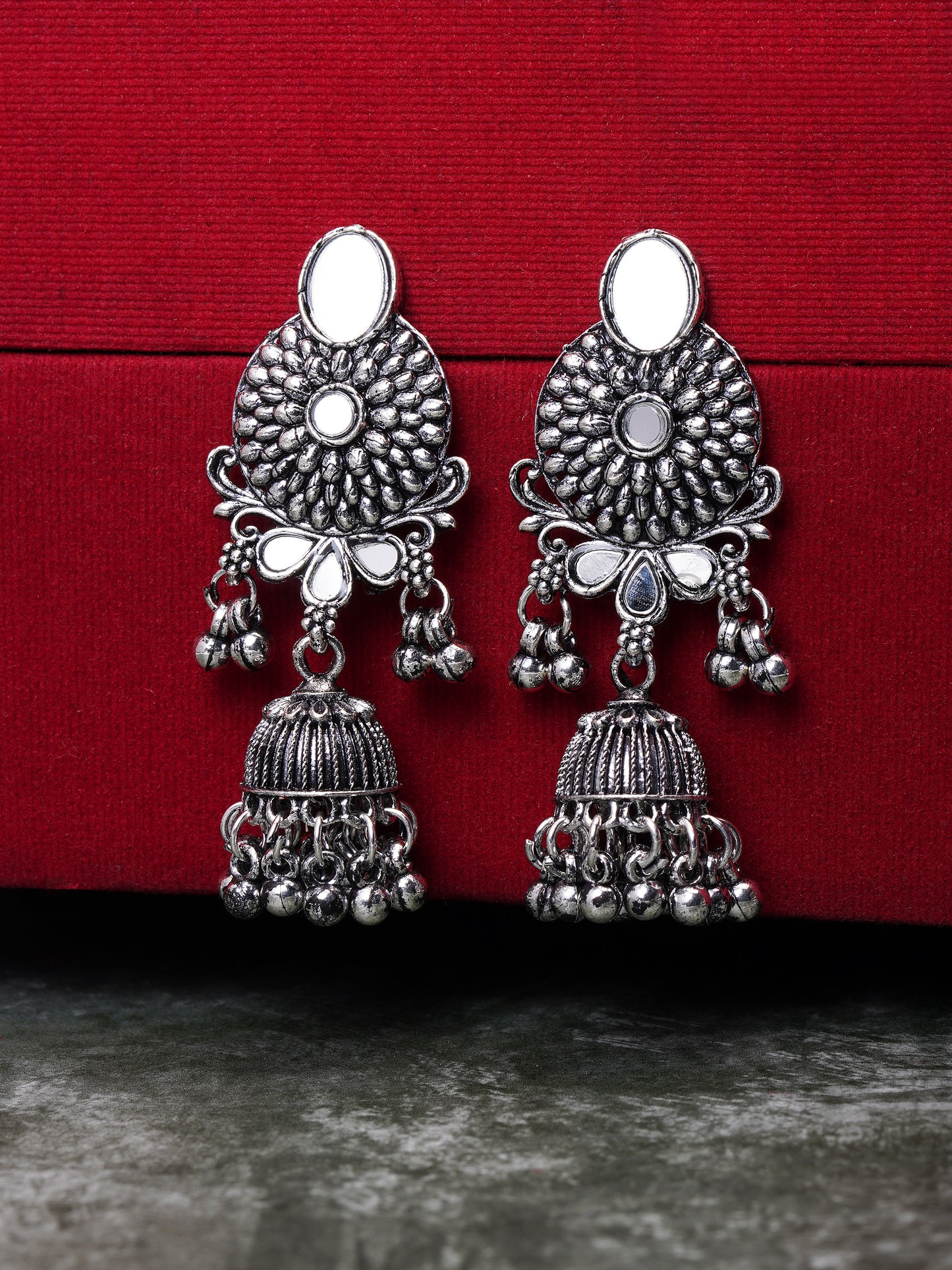 oxidised flower jhumka earring red background